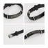 A black engraved bracelet featuring a silver clasp and a logo, showcased from multiple angles.
