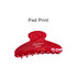 A red acetate hair clip with a curved design and multiple gripping teeth, featuring a logo.