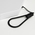 A foldable lantern in white with a black carrying strap attached. The design includes a compact, rectangular shape.