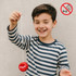 A wooden yoyo in vibrant red, held by a smiling child wearing a striped shirt, with a logo visible.
