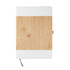 A notebook with a bamboo cover and white accents, featuring a grey ribbon bookmark.