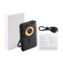 A black 10000mAh magnetic wireless power bank with a circular charging interface, USB port, and user manual.
