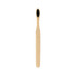 A large flat handle toothbrush with a natural bamboo handle and black bristles. Features a simplistic design.