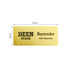 A metal name badge in gold, featuring engraved text and a logo, measuring 76mm by 38mm.