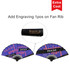 A bamboo hand fan featuring a mix of purple and black with creative graphic design. It includes a branding logo.