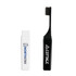 A foldable travel toothbrush in black, stored in a compact white case with a logo.