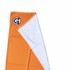 An orange beach towel with a white underside and a black logo on one corner.