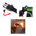 A black paracord survival bracelet with multiple features, including a compass, bottle opener, and tools.