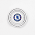 A circular glass ashtray featuring a logo in blue and white for a football club, with a silver rim.