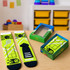 A pair of vibrant green socks with sports motifs in a colourful custom gift box with a windowed removable lid.