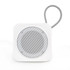 A white portable speaker with a metallic mesh grille and a wire loop for hanging.