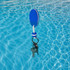 A blue EVA floating keychain with keys attached, floating on the surface of a clear blue pool.