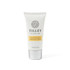 A hand and nail cream tube in white and silver, featuring a floral logo and a yellow label.