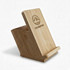 A bamboo mobile stand and pen holder with an angled design and a logo on the front.