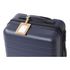 A navy suitcase with a cork luggage tag attached to the handle, featuring a minimalist design.