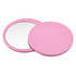A pink circular makeup mirror with a smooth finish, featuring two sides—one reflective and one plain.