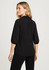 A black women's blouse with 3/4 puff sleeves, featuring a back yoke detail and a subtle logo.