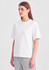 A white box tee is displayed on a model, featuring short sleeves and a relaxed fit.