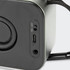A black Swiss Peak 10W Bass Speaker featuring power and audio input ports. The design includes a textured surface.