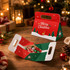 A foldable gift box in red and green with festive designs, featuring a handle for easy carrying.