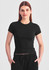 A fitted black women's baby tee with short sleeves, worn by a model against a grey background.