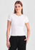 A women's baby tee in white, featuring short sleeves and a fitted design, displayed on a model.