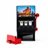 A 777 slot machine fridge magnet in black with red accents, featuring a sharpener and a scenic image on top.