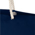 A navy blue tote bag with a white rope handle and a metal grommet. It features a subtle branding element.