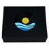 A black magnetic gift box featuring a colourful logo with a sun, waves, and circular patterns in blue and yellow.