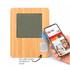 A bamboo desk clock featuring a grey display, with an NFC label and a hand holding a smartphone nearby.