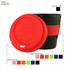 A reusable coffee cup with a black plastic body, a red silicone lid, and a red silicone band. Features a logo.