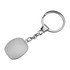 A metallic key ring with a smooth, white cubic pendant attached by a chain.