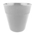 A plastic cup in white, featuring a ribbed texture on the upper half and a smooth lower half.