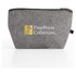 A grey cosmetic pack with a zip closure and a logo, suitable for toiletries and accessories.