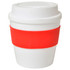 A small white cup with a red silicone band and a lid. The cup features a logo.