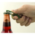 A drink bottle opener in green being used to remove a cap from a glass bottle with a vibrant liquid inside.