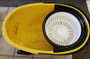 Dirt is captured by the scrubber at the floor of the bucket.