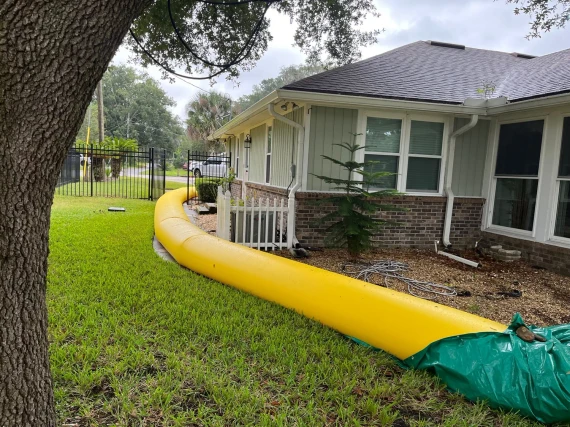 Guppy Water-Filled Flood Tubes protecting the perimeter of a house
