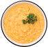 Bowl of ReadyWise Open Range cheesy potato soup with parsley garnish