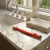 Lactona M39 truesoft toothbrush lying on a sunny marble sink