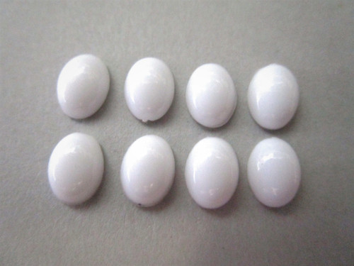 Opaque white 10x14mm oval cabochon vintage lucite