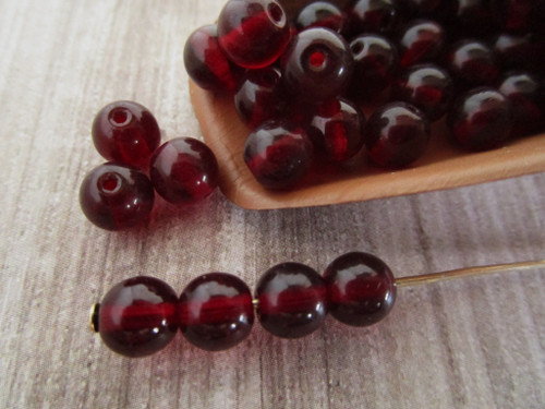 Garnet red 6mm round druk Czech glass beads