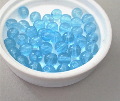 Aqua blue 6mm round druk Czech glass beads