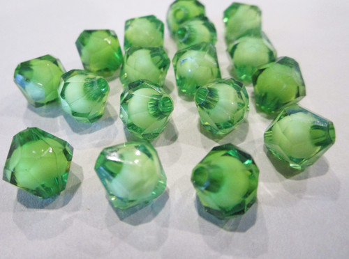 Green 10mm faceted bicone acrylic bead in a bead