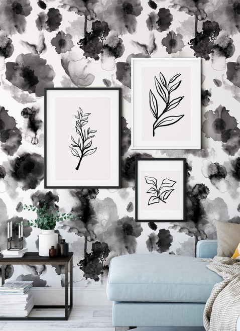 abstract black and white floral self-adhesive wallpaper on a living room wall with wall art