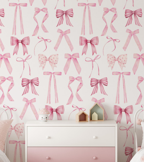 Paperbird Home Blue Bow Peel and Stick Wallpaper featuring a delicate hand-drawn ribbon pattern, perfect for a coquette-style nursery or a charming girl's bedroom.