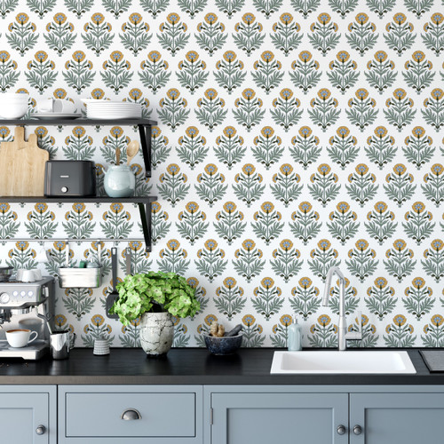 Marigold Block Print Peel and Stick Wallpaper by Paperbird Home in yellow and blue ochre tones, creating a cozy and vibrant accent wall in a kitchen.