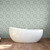 close up of  stand alone tub in front of Kelly tile  peel and stick wallpaper