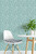 small white chair with potted plant on a small circular table and Diagonal Dashes Peel and Stick Wallpaper