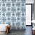 bathroom with bathtub and blue octopus wallpaper on the wall behind it